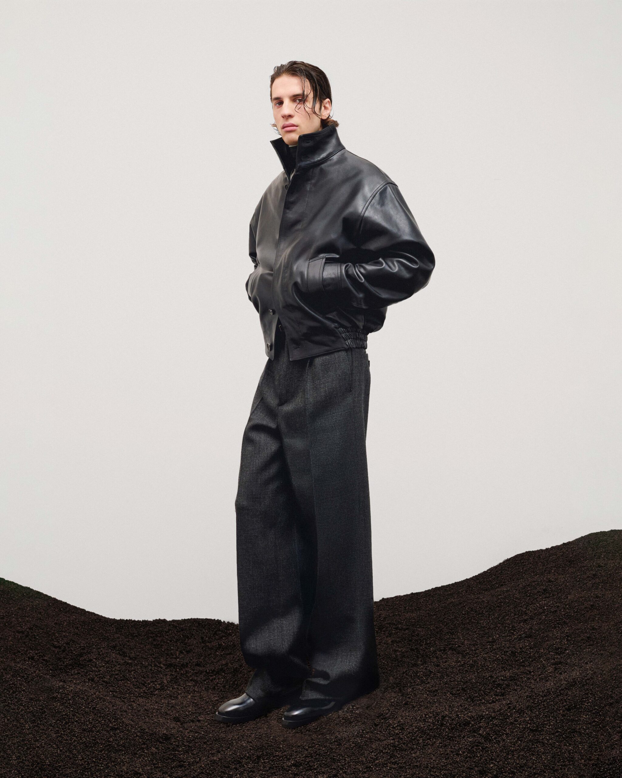Black leather bomber jacket with high collar, wide wool trousers and black leather ankle boots, menswear, Durazzi Milano FW26