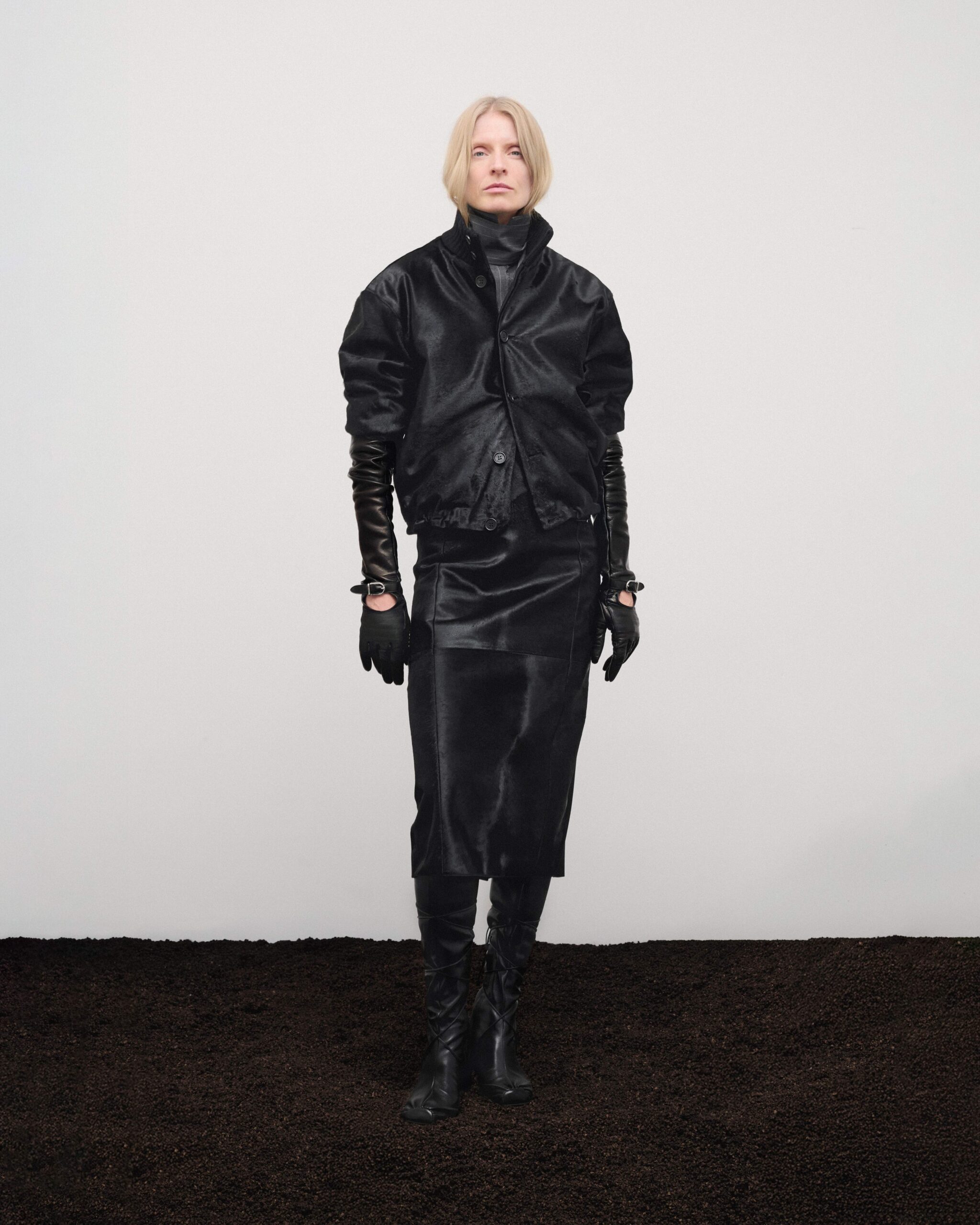 Pony hair bomber with pony hair pencil skirt, long leather gloves and knee-high boots, Durazzi Milano FW26